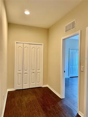 a kitchen with a sink and a mirror