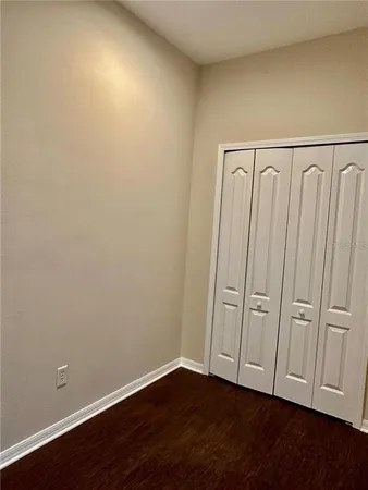 a utility room with cabinets washer and dryer