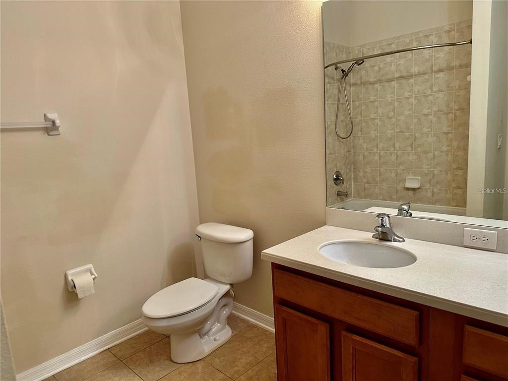 9249 Edistro Place New Port Richey, FL 34654 - Photo 61 of 82 a bathroom with a sink a toilet and shower