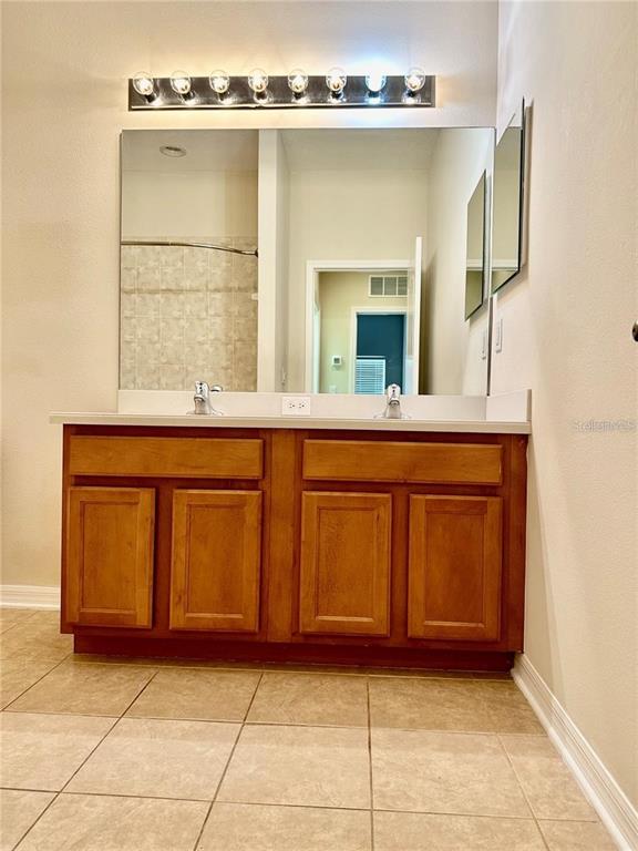 9249 Edistro Place New Port Richey, FL 34654 - Photo 62 of 82 a kitchen with a sink and a mirror