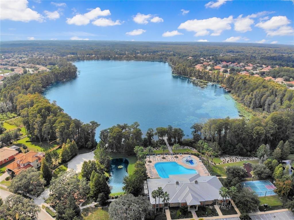 9249 Edistro Place New Port Richey, FL 34654 - Photo 72 of 82 an aerial view of lake and residential houses with outdoor space
