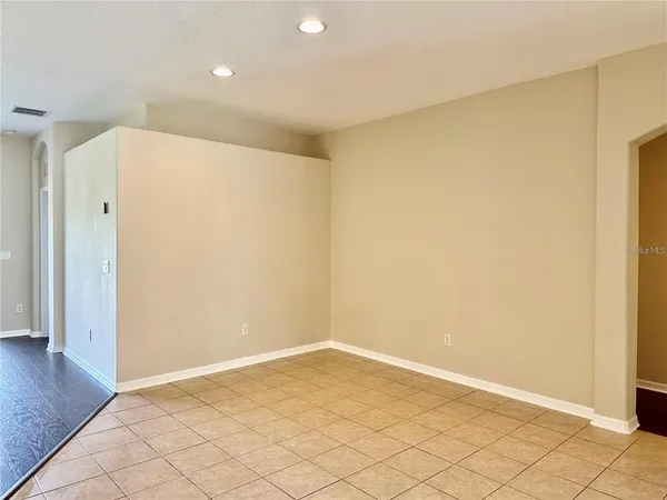 a view of a livingroom with a hardwood floor and a ceiling fan