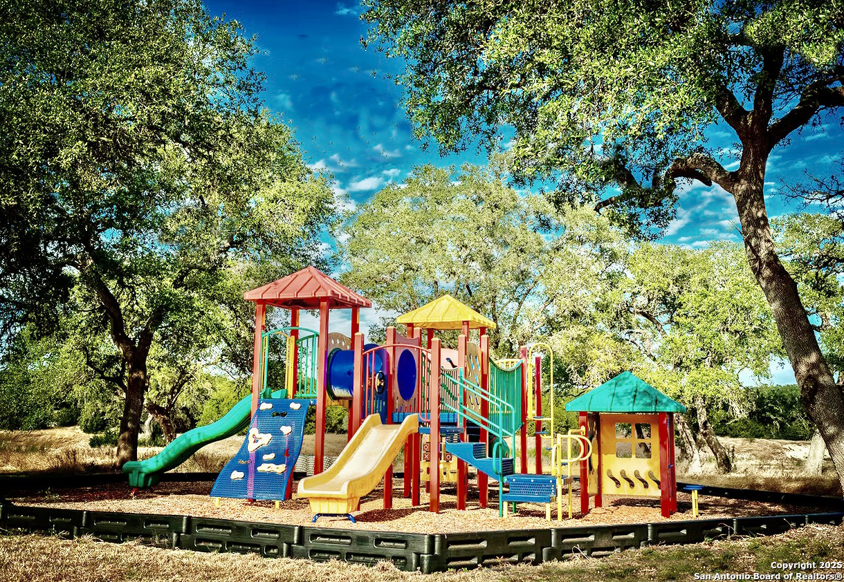 Lot 149 Serenity Pass/ Restless Wind Spring Branch, TX 78070 - Photo 14 of 15 a view of a park with large trees