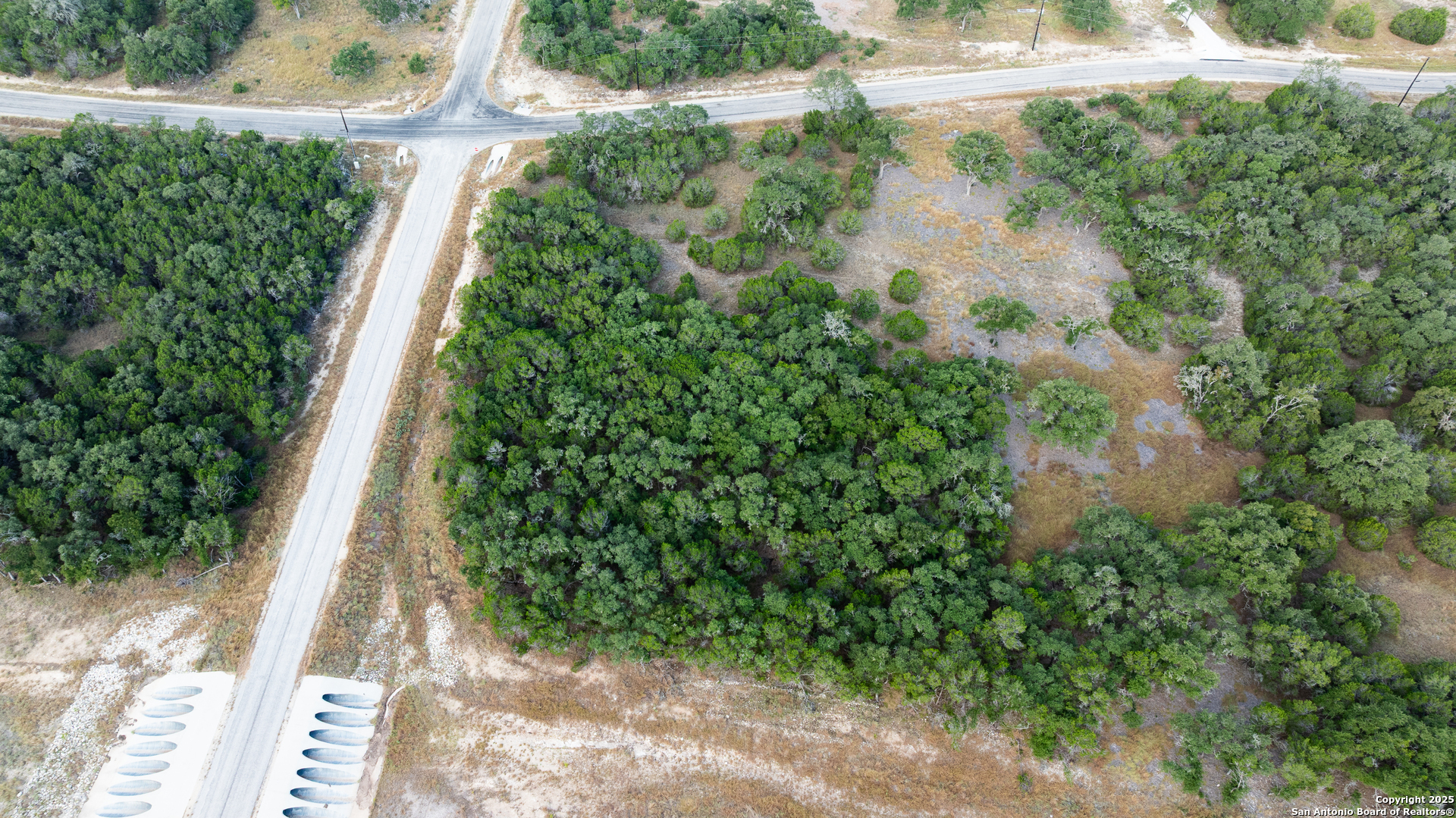 Lot 149 Serenity Pass/ Restless Wind Spring Branch, TX 78070 - Photo 8 of 15 a view of a yard with plants and a fountain