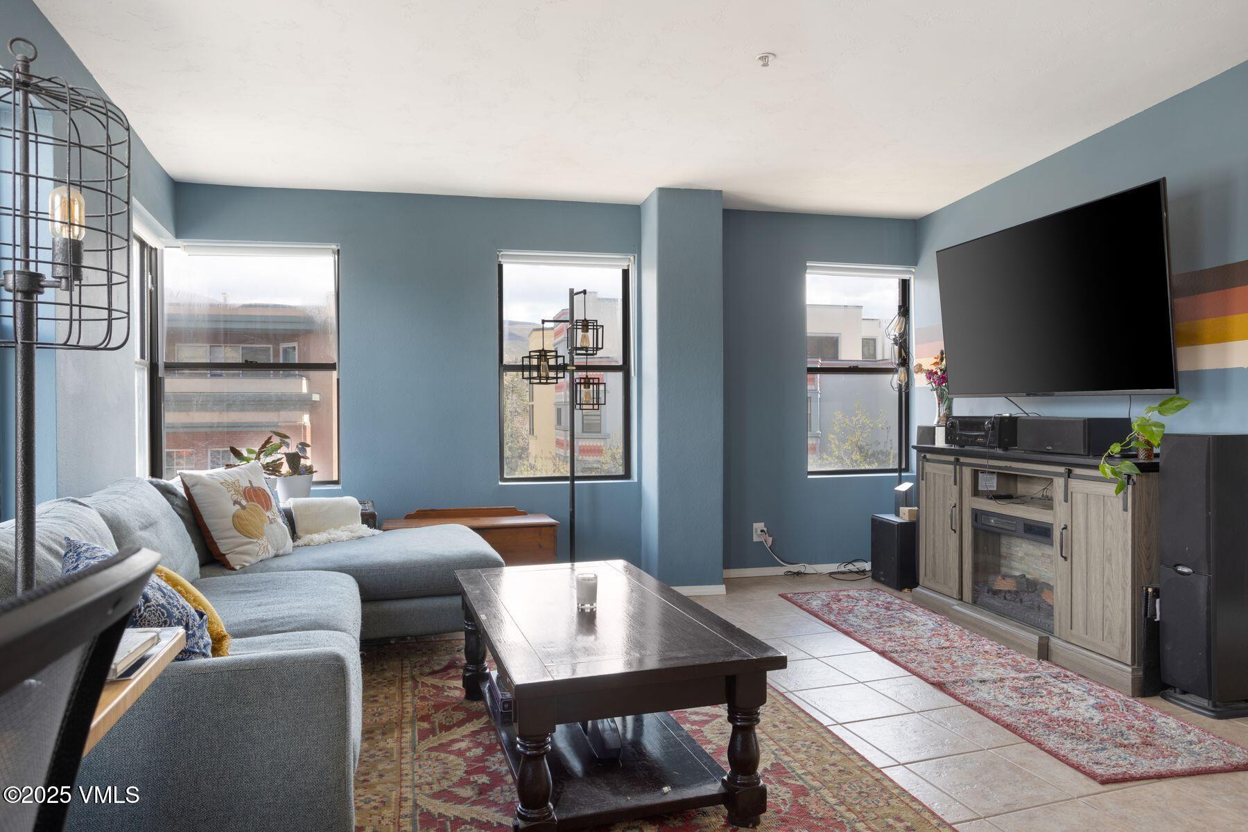 34295 Highway 6, Unit 207 Edwards, CO 81632 - Photo 1 of 23 a living room with furniture and a flat screen tv
