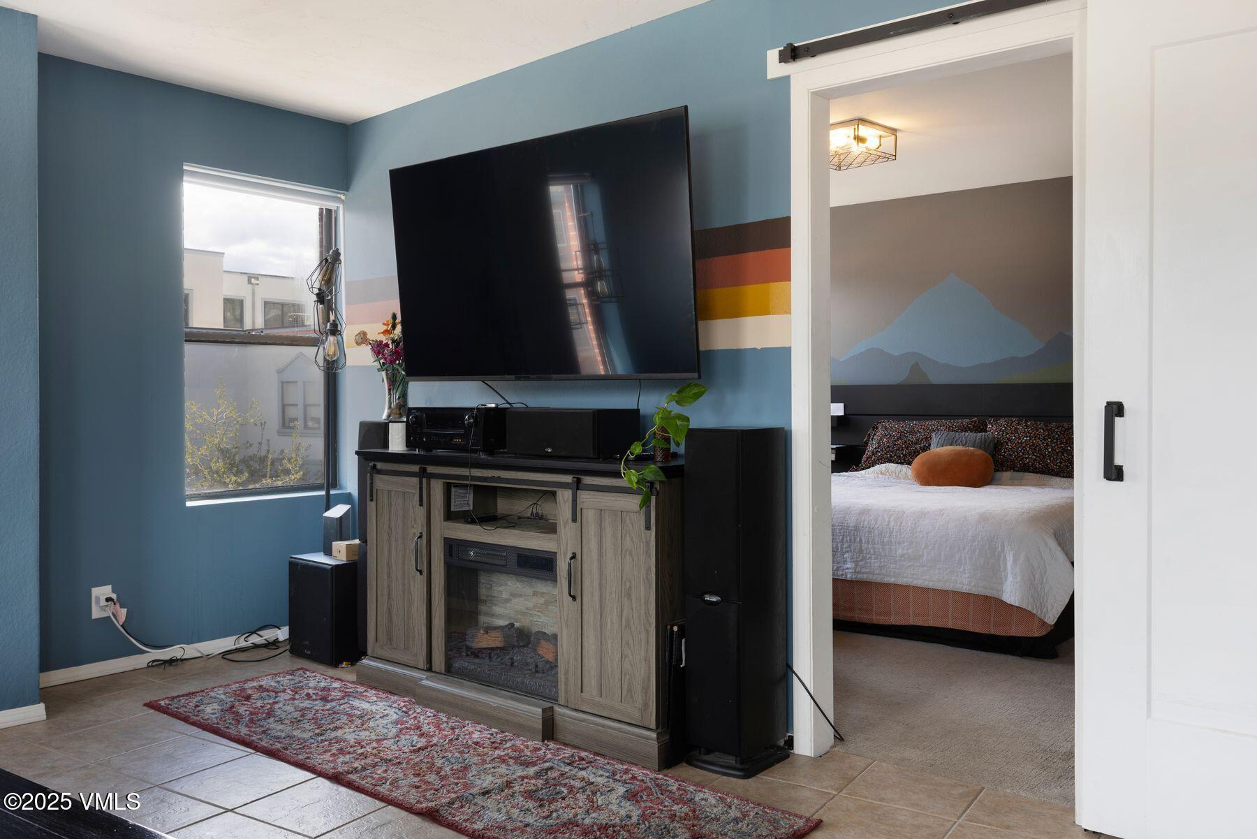 34295 Highway 6, Unit 207 Edwards, CO 81632 - Photo 12 of 23 a bedroom with a bed and a television