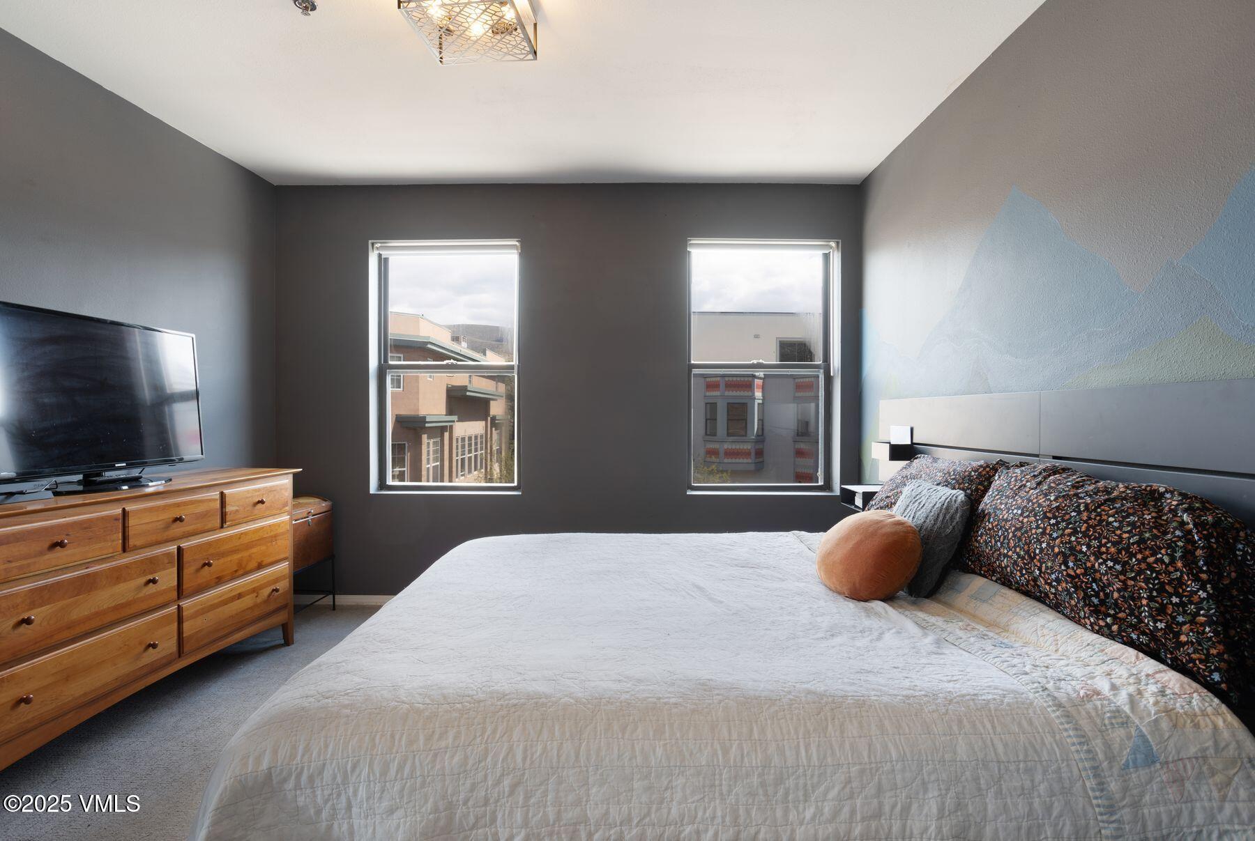 34295 Highway 6, Unit 207 Edwards, CO 81632 - Photo 14 of 23 a bedroom with a bed and flat screen tv