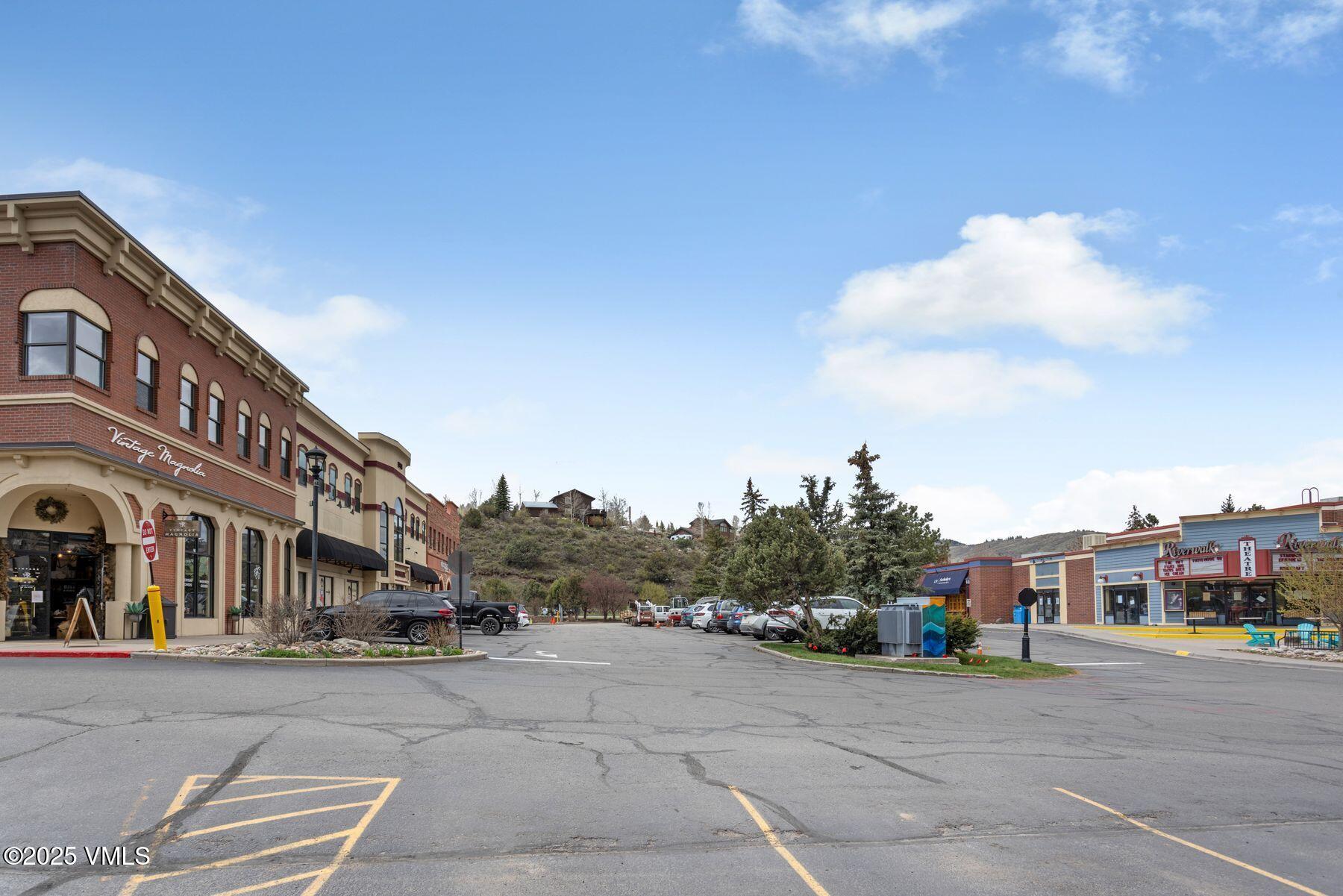 34295 Highway 6, Unit 207 Edwards, CO 81632 - Photo 20 of 23 a city street lined with buildings and trees