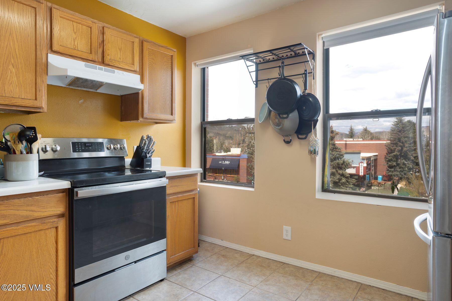 34295 Highway 6, Unit 207 Edwards, CO 81632 - Photo 10 of 23 a kitchen with stainless steel appliances granite countertop a stove a sink and a microwave