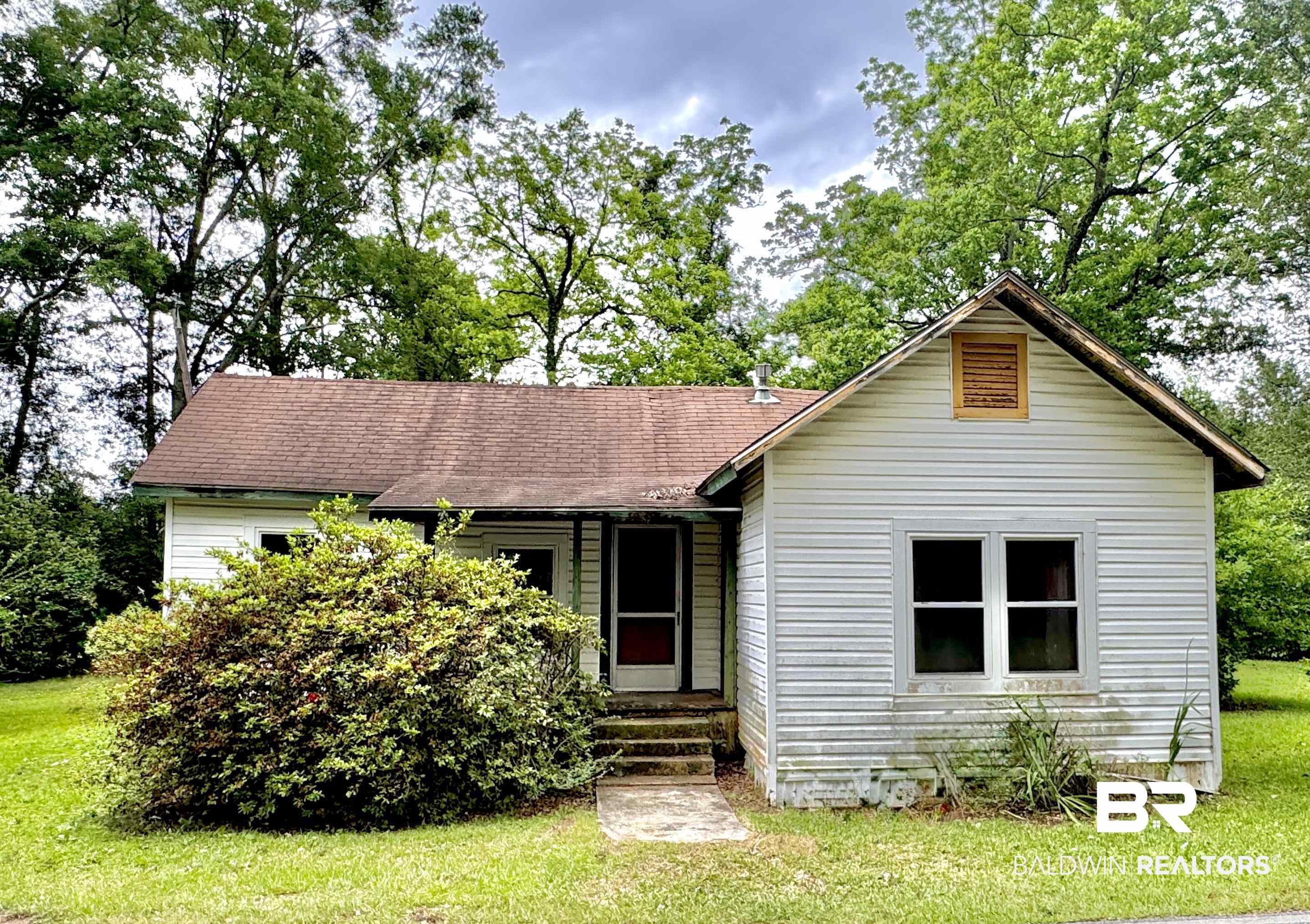 42186 Nicholsville Road Bay Minette, AL 36507 - Photo 1 of 10 View of front facade featuring a front lawn and a shingled roof