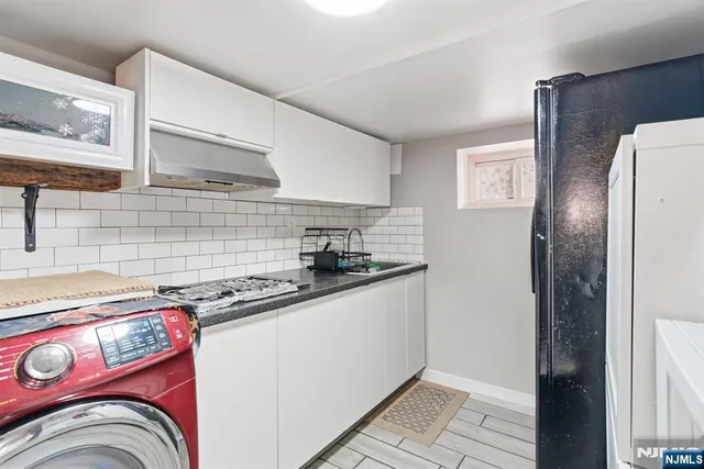 a kitchen that has a stove and a sink