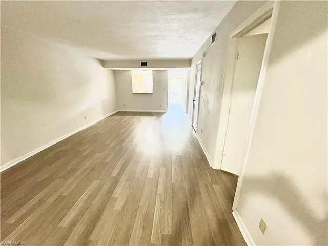 a view of wooden floor in an empty room