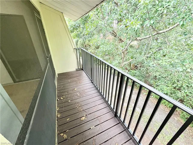 a view of balcony with wooden floor