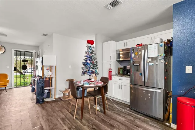 a kitchen with stainless steel appliances a refrigerator and a stove