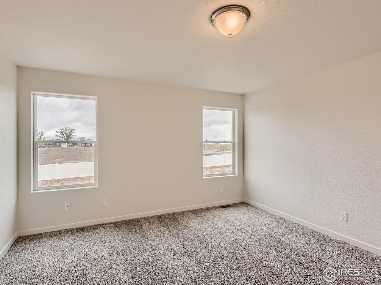 2538 Doe Rdg Way Johnstown, CO 80534 - Photo 15 of 28 an empty room with windows