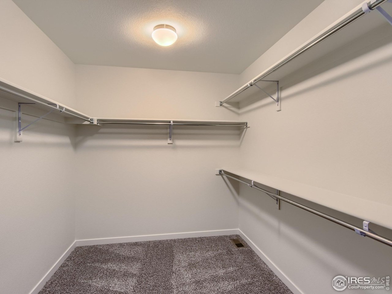 2538 Doe Rdg Way Johnstown, CO 80534 - Photo 19 of 28 a view of an empty walk in closet