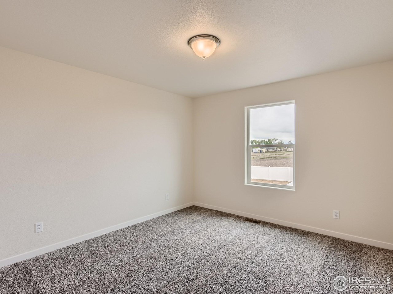 2538 Doe Rdg Way Johnstown, CO 80534 - Photo 20 of 28 an empty room with windows