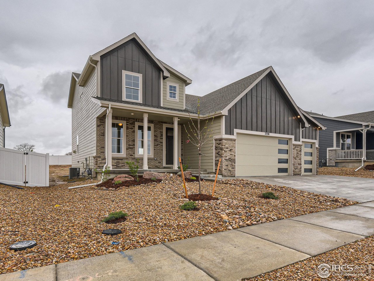 2538 Doe Rdg Way Johnstown, CO 80534 - Photo 2 of 28 a front view of a house with yard and seating area