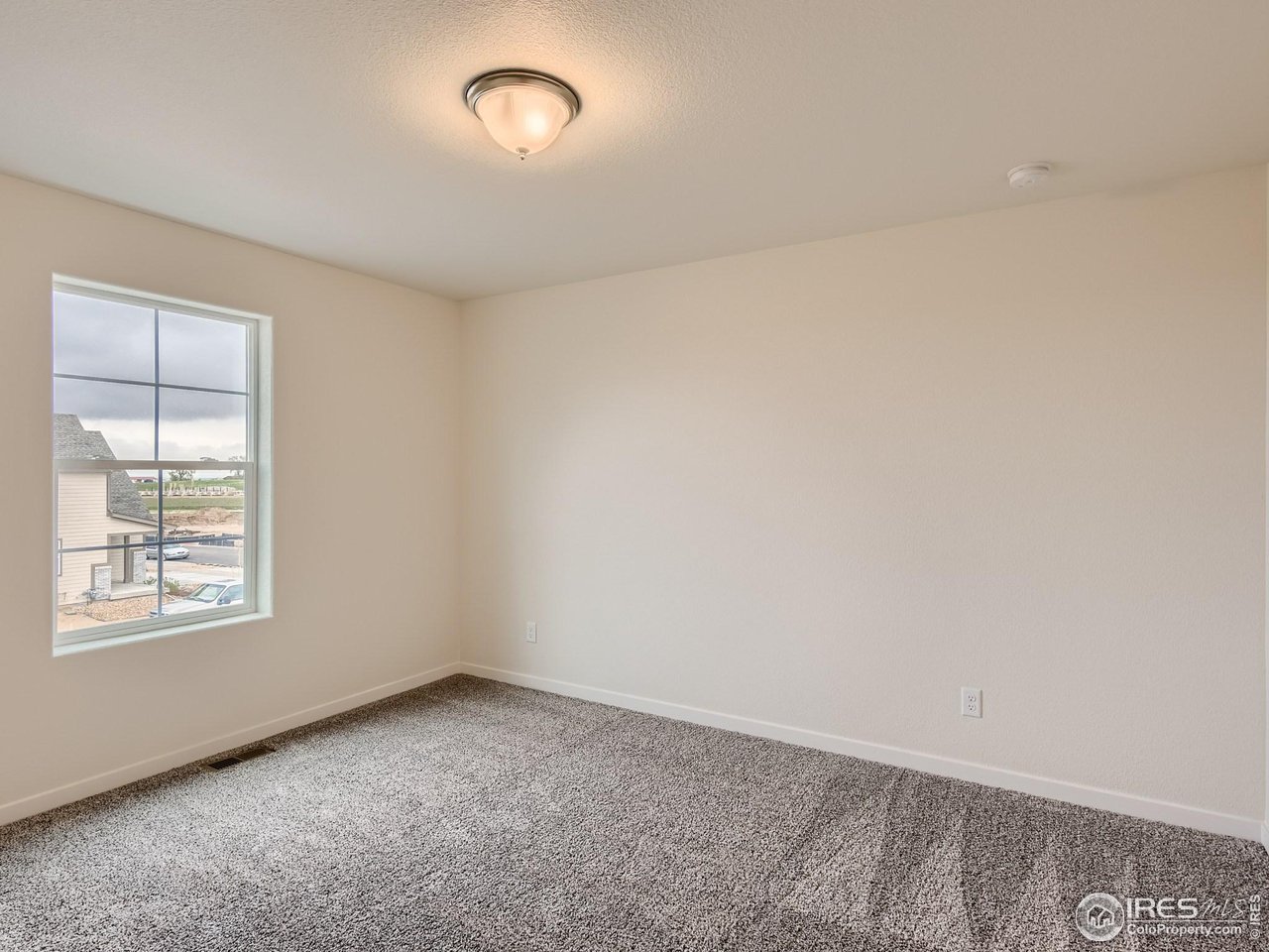 2538 Doe Rdg Way Johnstown, CO 80534 - Photo 23 of 28 an empty room with a window