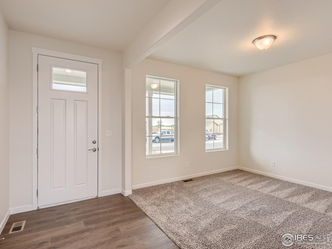 2538 Doe Rdg Way Johnstown, CO 80534 - Photo 4 of 28 an empty room with windows