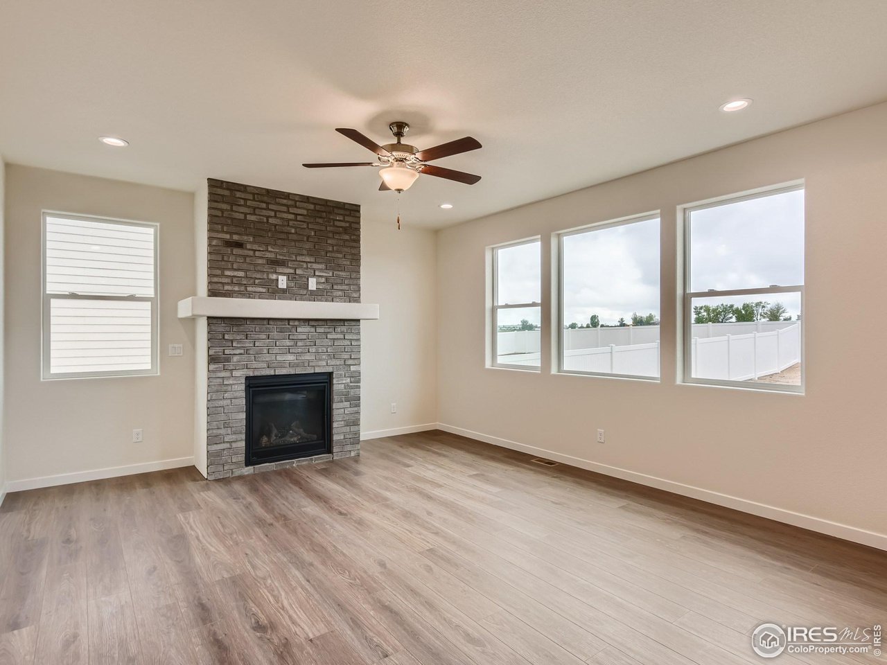 2538 Doe Rdg Way Johnstown, CO 80534 - Photo 5 of 28 a view of an empty room with a fireplace and a window