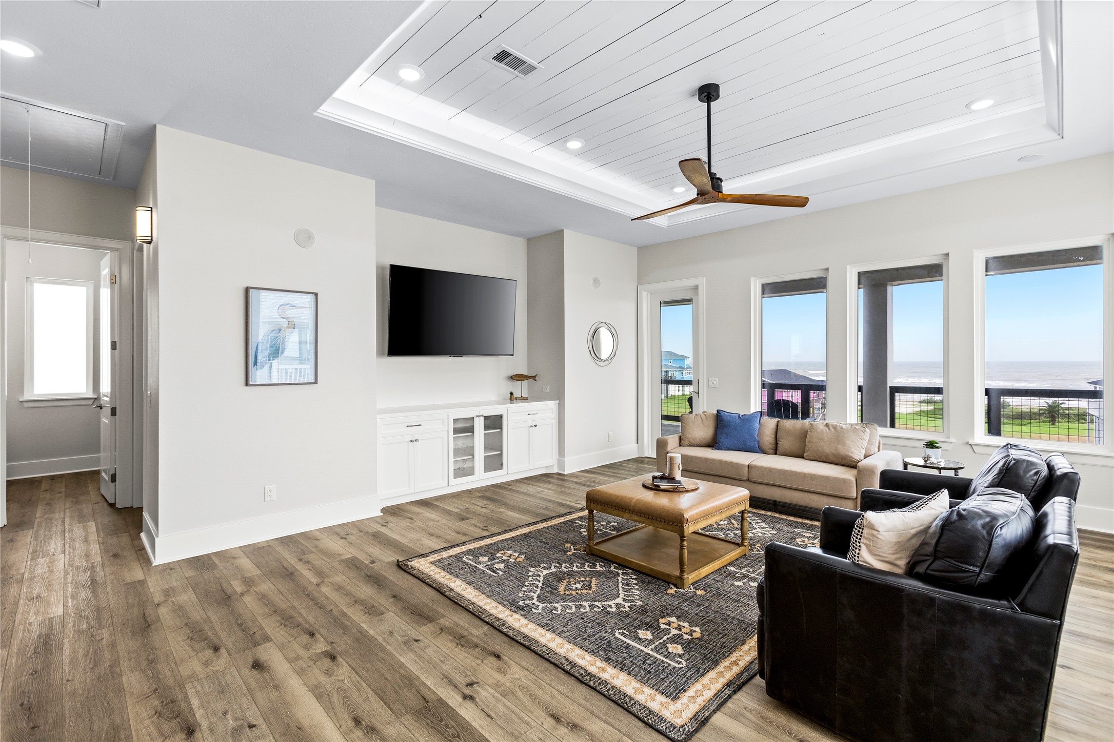 1986 Patton Beach Road Crystal Beach, TX 77650 - Photo 26 of 45 a living room with furniture a flat screen tv and a table