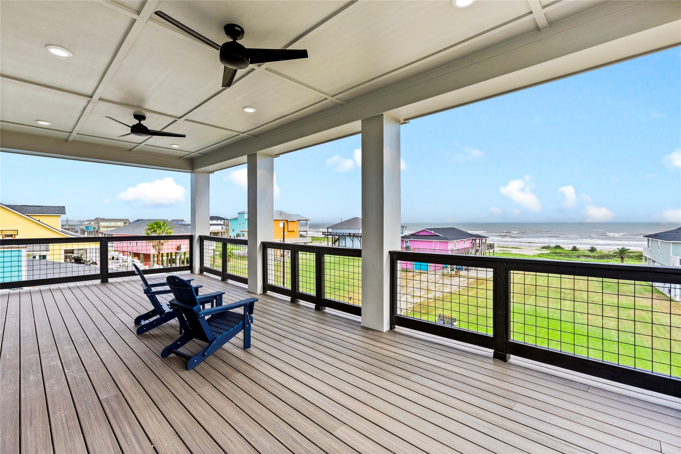 1986 Patton Beach Road Crystal Beach, TX 77650 - Photo 28 of 45 a view of a balcony with chairs and wooden floor