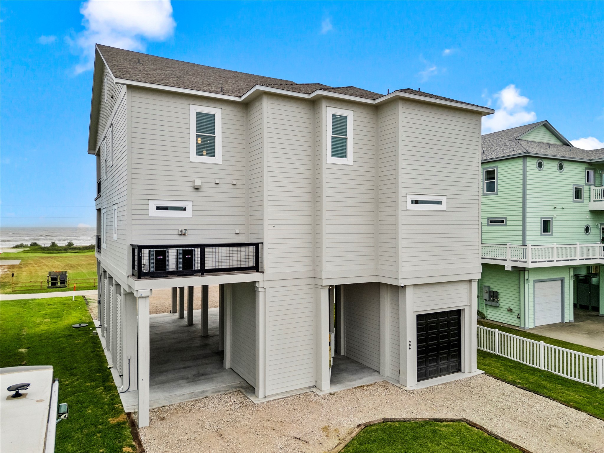 1986 Patton Beach Road Crystal Beach, TX 77650 - Photo 42 of 45 a view of a house with a yard and balcony
