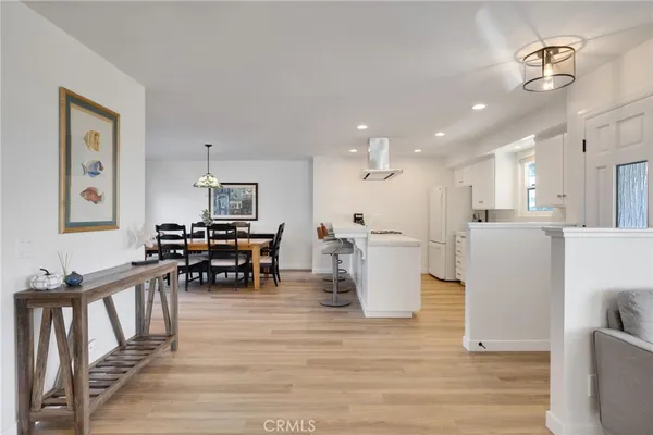 a view of kitchen with furniture and wooden floor