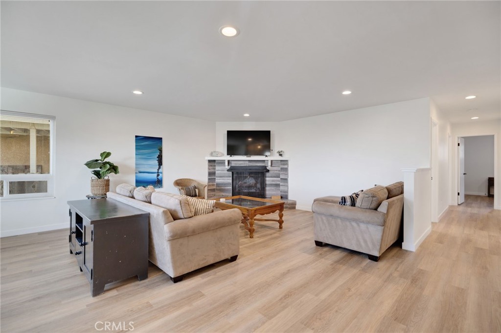 2091 Circle Drive Cayucos, CA 93430 - Photo 4 of 21 a living room with fireplace furniture and a wooden floor