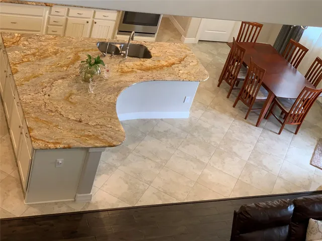 a kitchen with stainless steel appliances granite countertop a refrigerator sink and cabinets
