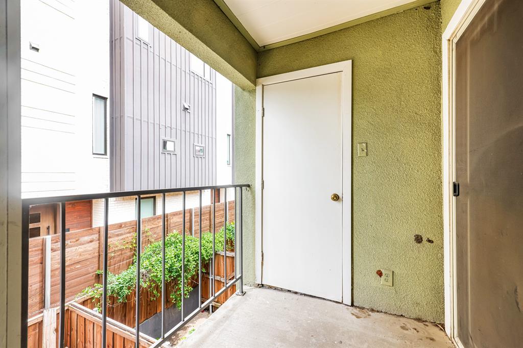 4622 Monarch Street, Unit 202 Dallas, TX 75204 - Photo 14 of 16 Private outdoor balcony with concrete flooring and a black metal railing
