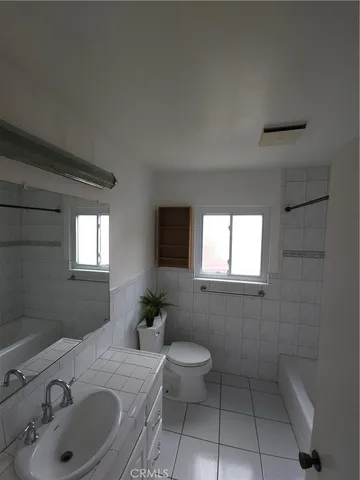 a bathroom with a sink toilet and tub