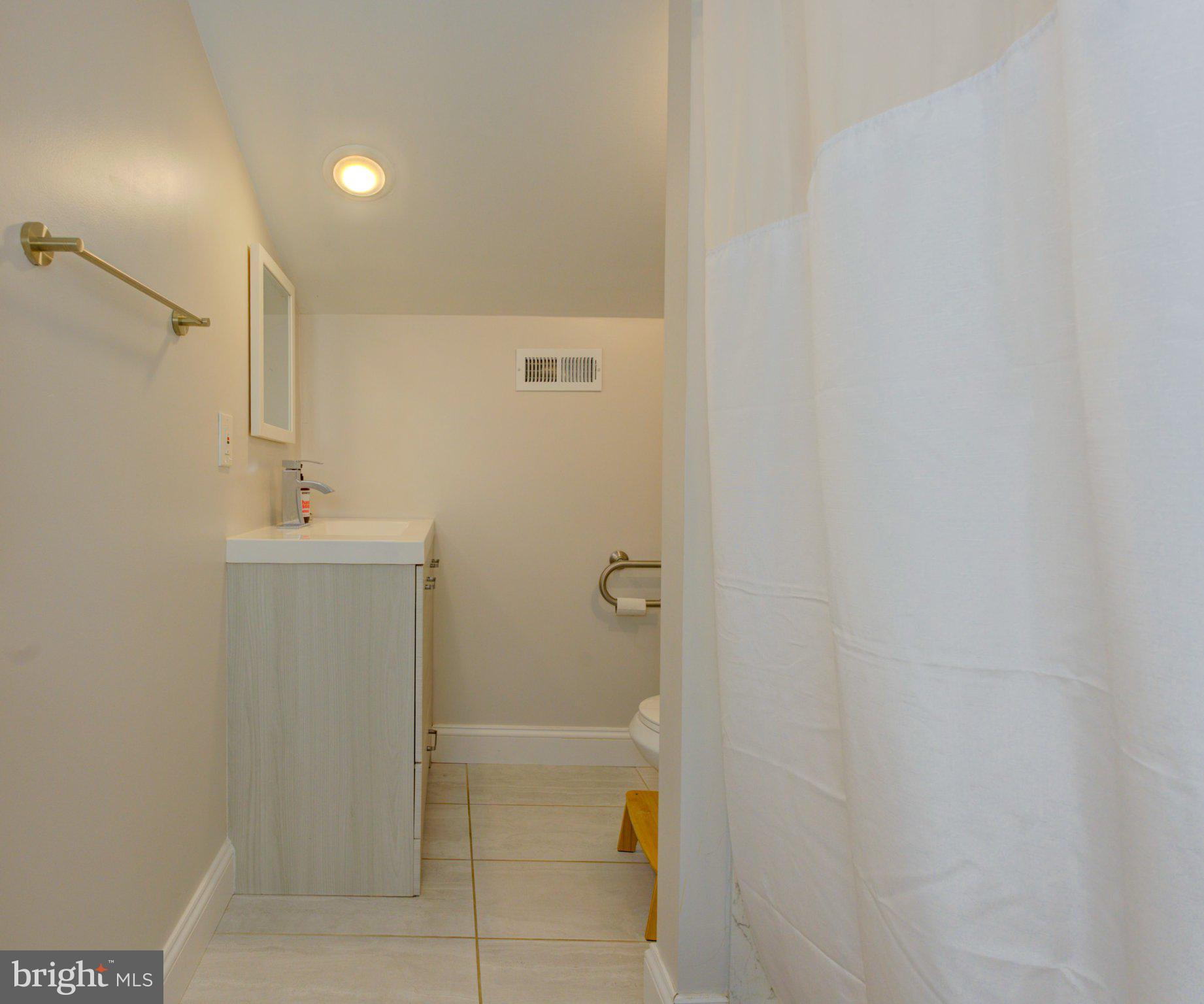 1602 Veirs Mill Road Rockville, MD 20851 - Photo 44 of 50 Modern bathroom with sleek finishes.