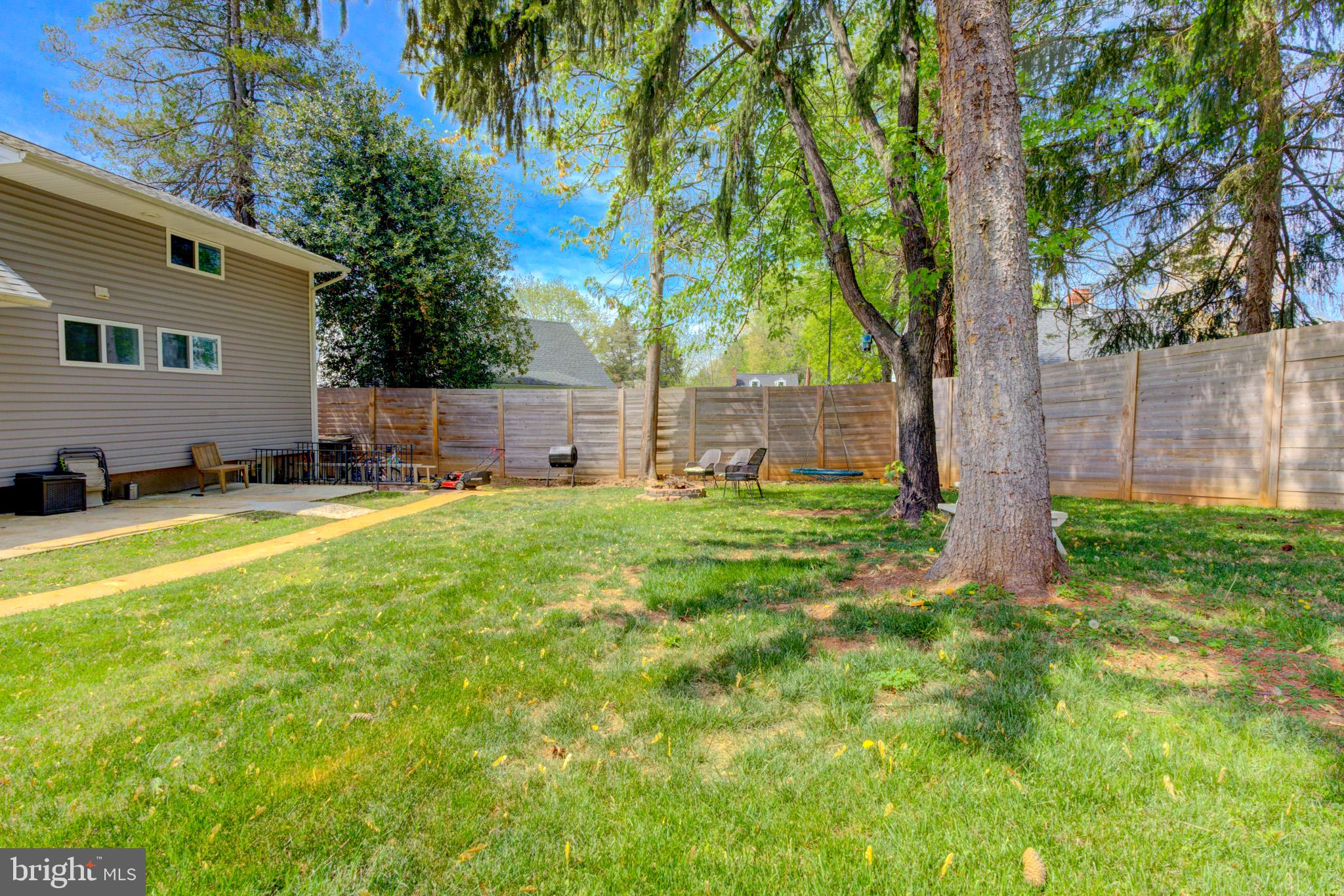 1602 Veirs Mill Road Rockville, MD 20851 - Photo 47 of 50 Serene backyard oasis with lush greenery.
