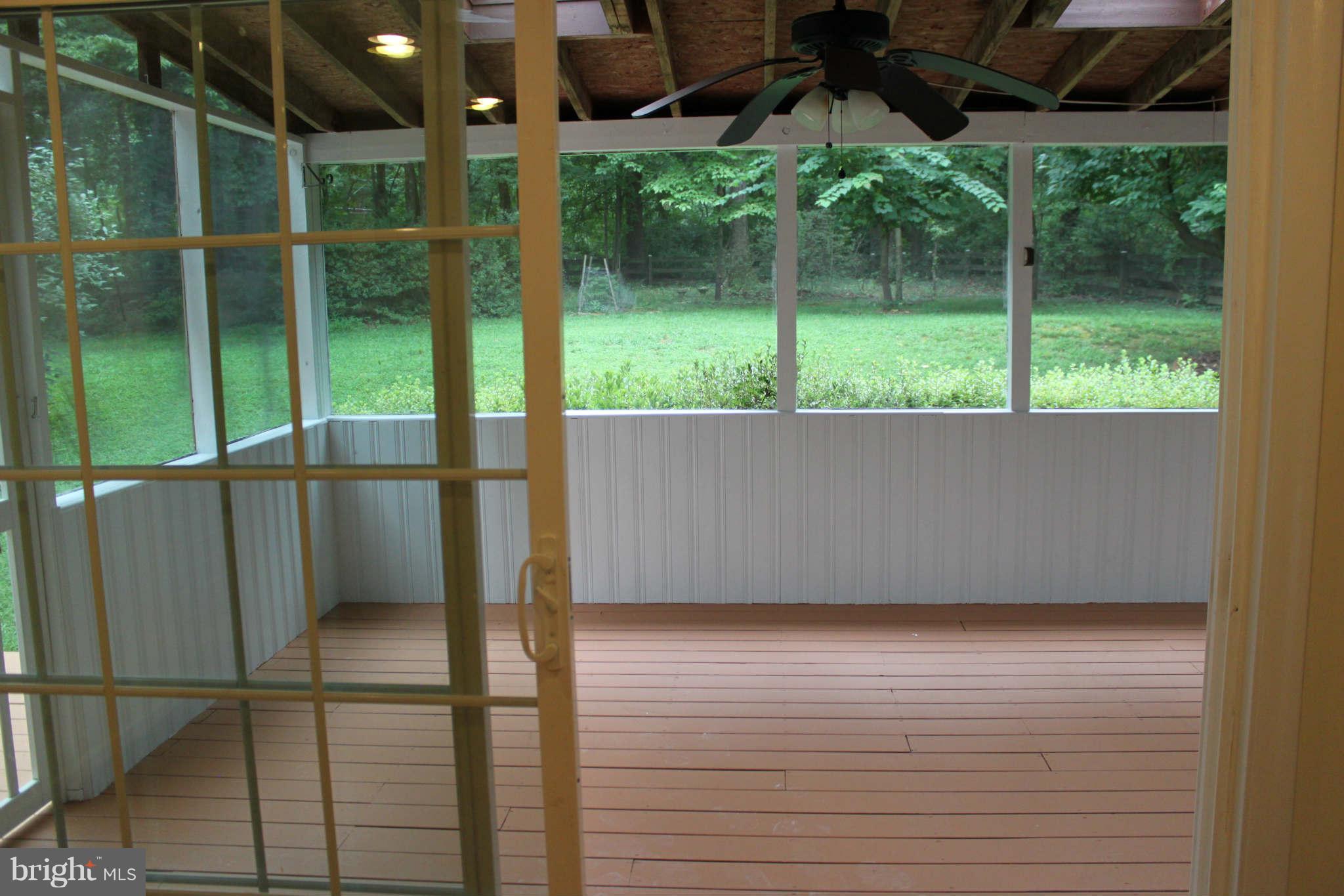 11027 Howland Drive Reston, VA 20191 - Photo 13 of 15 backyard view through screen porch