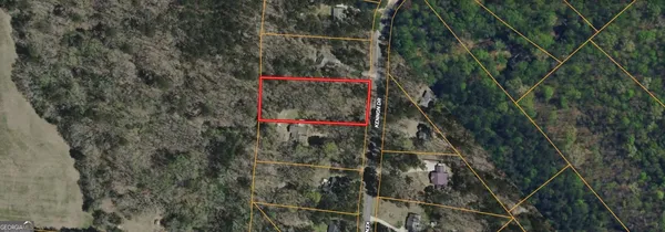 a signage on a wall next to a road