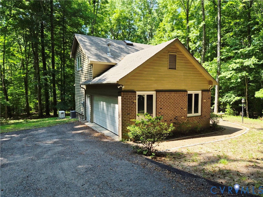 4099 Doe Run Road Hopewell, VA 23860 - Photo 2 of 35 a front view of a house with a yard and potted plants