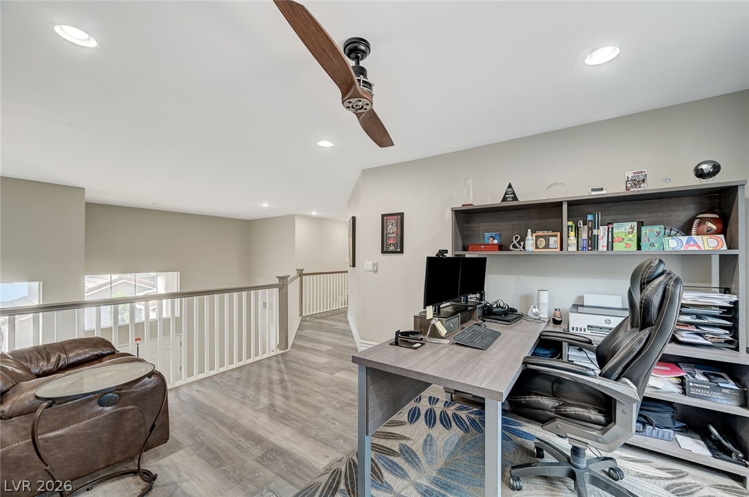 2391 Rainswept Avenue Henderson, NV 89052 - Photo 43 of 62 This versatile loft area offers a dedicated workspace and overlooks the lower level.