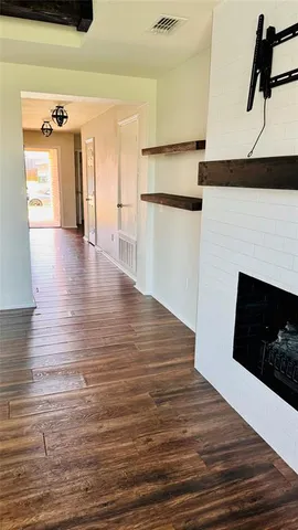 a view of a kitchen from the hallway