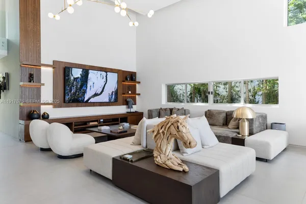 a view of a livingroom with furniture and window