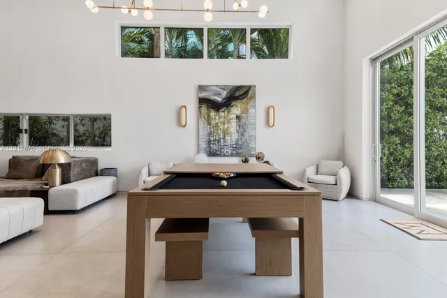 a kitchen with granite countertop a sink and a large window
