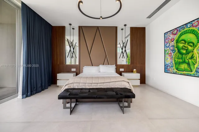 a bed sitting in a spacious bedroom next to a window