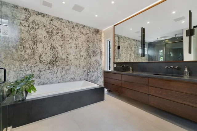 a bedroom with a bed and a television