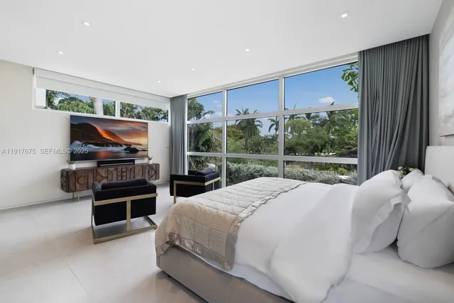 a view of a room with a table and chairs