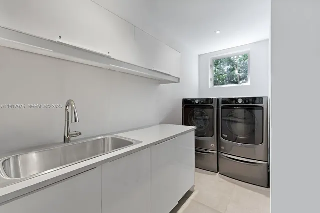 a aerial view of a house with plants and large trees
