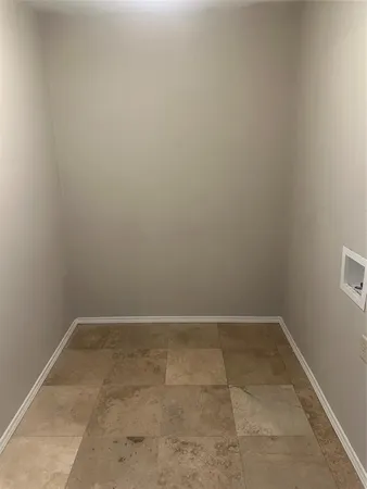 a view of empty room with a window