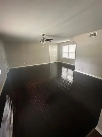 a view of empty room with windows