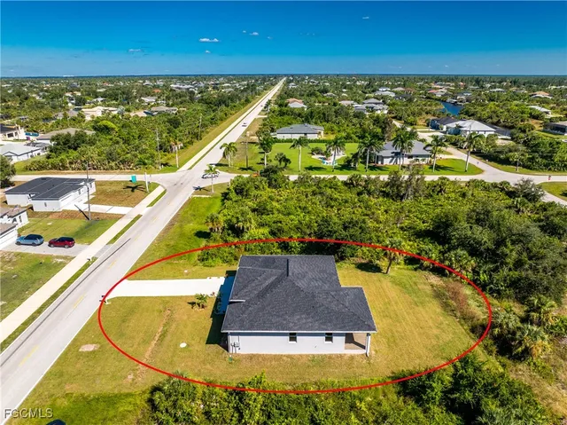 a view of swimming pool with a yard and outdoor seating
