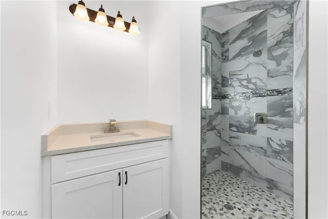 a bathroom with a sink and a shower